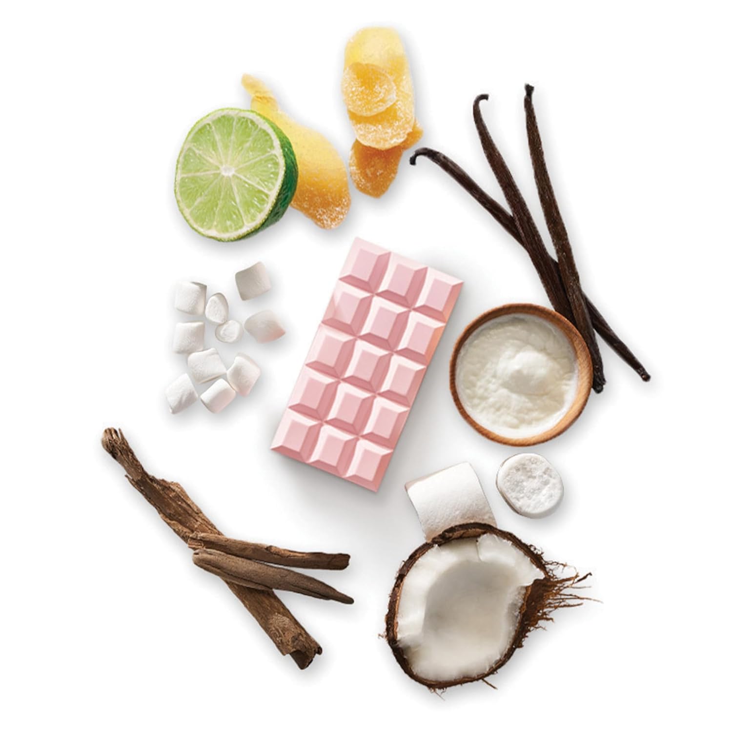 Ingredients for a sweet recipe including lime, ginger, vanilla, coconut, marshmallows, and pink chocolate bar.